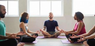 Practicing group yoga is good for body and soul