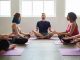 Practicing group yoga is good for body and soul